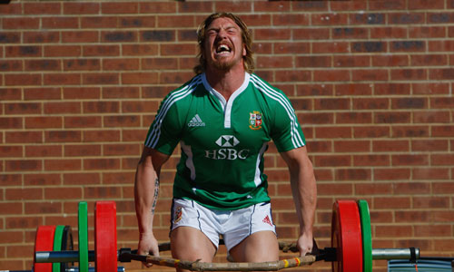 British & Irish Lions back-row Andy Powell lifts weights at St David's college