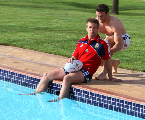 British and Irish Lions player Luke Fitzgerald is pushed into the cold swimming pool in Bloemfontein
