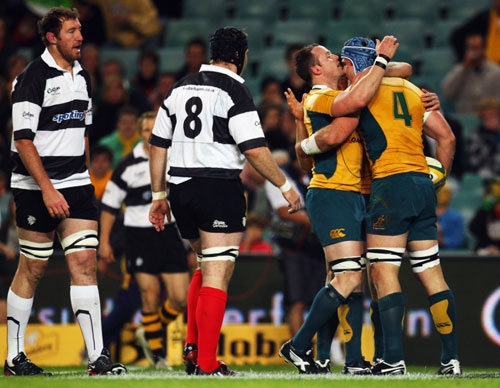 Australia's James Horwill is congratulated after scoring a try against the Barbarians