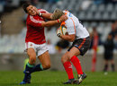 British & Irish Lions' fly-half James Hook is handed off by Jacques-Louis Potgieter 