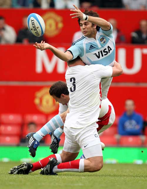 Argentina centre Gonzalo Tiesi is tackled by David Wilson