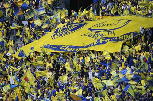 Clermont fans cheer their side with a huge banner