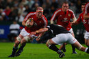 British & Irish Lions captain Paul O'Connell crunches against the Sharks defence
