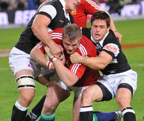Lions No.8 Jamie Heaslip barges his way towards the Sharks' line