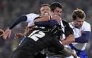 France's Damien Traille is tackled by New Zealand's Ma'a Nonu