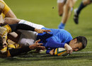 Italy's Kaine Robertson scores a try during the First Test against Australia