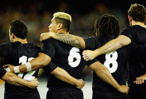 All Blacks link arms for the national anthem