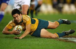 Australia winger Mark Gerrard dives in to ground the ball during the Tri Nations test match between Australia and South Africa, Australia v South Africa, Tri Nations, Telstra Stadium, July 7 2007.