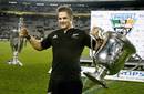 Richie McCaw lifts the Tri Nations trophy and Bledisloe Cup