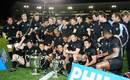 The All Blacks celebrate with the Tri Nations trophy
