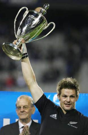 New Zealand captain Richie McCaw lifts the Tri Nations trophy following his side's 34-27 victory over Australia. New Zealand v Australia, Tri Nations, Eden Park, August 19 2006.