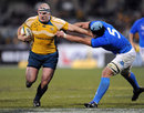 Australia's Stephen Moore beats a tackle from Italy's Carlo Antonio Del Fava during the First Test