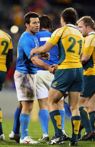 Australian Rugby League exile Craig Gower of Italy shakes hands with Australia's Quade Cooper after the First Test, Canberra Stadium, June 13, 2009