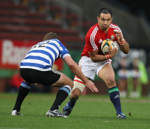 British & Irish Lions centre Riki Flutey is tackled by Peter Grant against Western Province