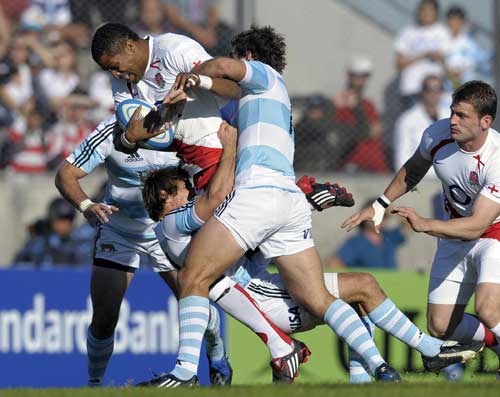 England fullback Delon Armitage crashes in to the Argentina defence