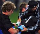 New Zealand flanker Adam Thomson receives treatment for an injury