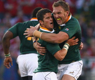 Morne Steyn of South Africa celebrates kicking the match and series winning kick with team mate Andries Bekker during the Second Test match between South Africa and the British and Irish Lions at Loftus Versfeld on June 27, 2009 in Pretoria, South Africa