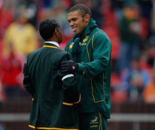 South Africa coach Peter de Villiers sports a white armband, in support of Bakkies Botha, while talking to Bryan Habana, South Africa v British & Irish Lions, third Test, Ellis Park, Johannesburg, July 4, 2009