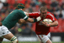 Lions prop Phil Vickery is tackled by Victor Matfield