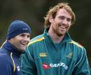 Australia flanker Rocky Elsom shares a joke with former rugby league player Peter Ryan