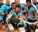 All Blacks skipper Richie McCaw fires the ball out of a ruck during training