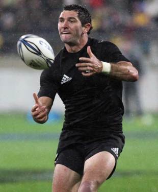 New Zealand fly-half Stephen Donald passes the ball
