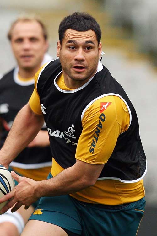 Wallabies flanker George Smith looks to pass the ball in training