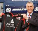 New Edinburgh coach Rob Moffatt poses with a club shirt