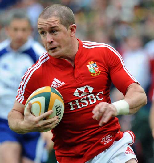 Lions winger Shane Williams crosses for a try