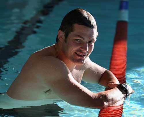 New Zealand skipper Richie McCaw takes is easy during a pool session