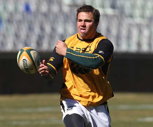 South Africa flanker Heinrich Brussow passes the ball during training 
