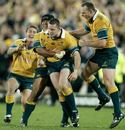 Australia's Matthew Burke is congratulated after landing the game-winning penalty against New Zealand in 2002