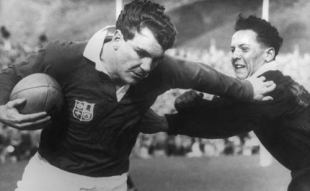 Irish winger Tony O'Reilly of the Lions fends off D J Davison of the Junior All Blacks, Lions v Junior All Blacks, Lions Tour, Wellington, September 14, 1959