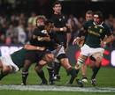 All Black wing Sitiveni Sivivatu is tackled by Francois Steyn in Durban