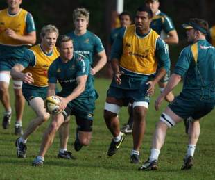 Australia fly-half Matt Giteau runs with the ball during training at Westerford High School, Cape Town, South Africa, August 3, 2009
