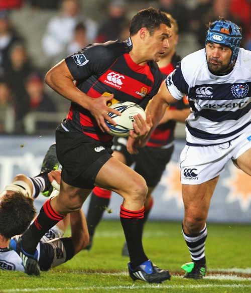Canterbury's Dan Carter stretches the Auckland defence