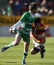 Manawatu's Andre Taylor looks for the off-load whilst holding off Callum Bruce of Waikato
