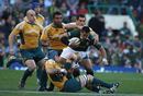Pierre Spies of South Africa is tackled by James Horwill and George Smith in Cape Town