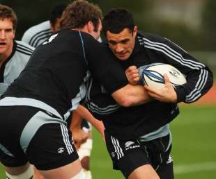 All Blacks fly-half Dan Carter is tackled during training at Trusts Stadium, Auckland, New Zealand, August 12, 2009