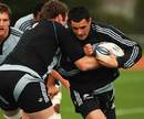 All Blacks fly-half Dan Carter is tackled during training 