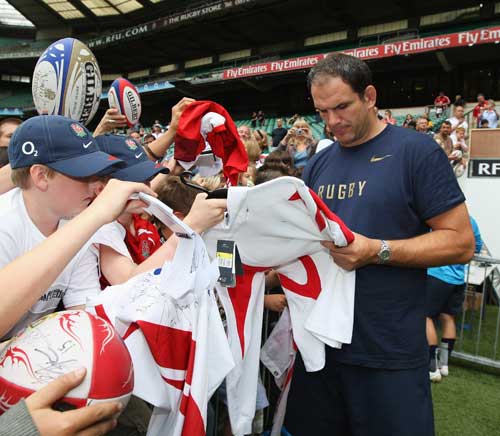 England manager Martin Johnson signs autographs for fans at Twickenham