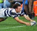Auckland's Dave Thomas touches down for a try