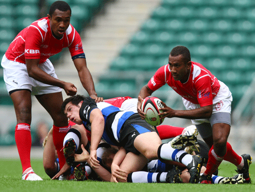 The British Army's Maika Burenivalu gets the ball away from a ruck
