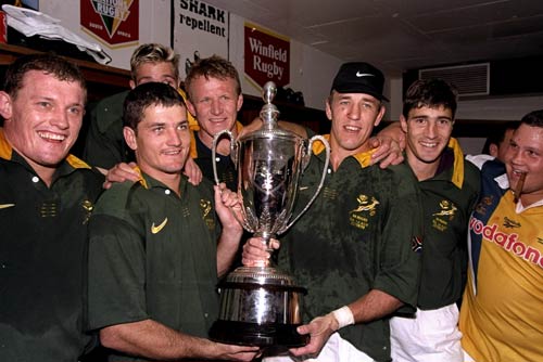 The Springboks celebrate with the Tri-Nations trophy after their win in Johannesburg