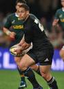 New Zealand's Luke McAlister looks to pass the ball