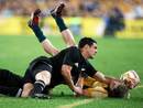 All Black fly-half Dan Carter bundles James O'Connor in to touch