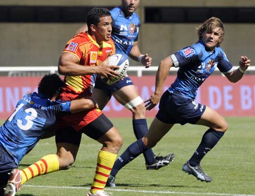 Perpignan centre Maxime Mermoz is shackled by the Montpellier defence