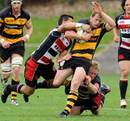 Taranaki's Ben Souness is tackled by the Counties Manukau defence