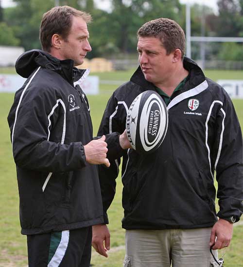 London Irish head coach Toby Booth talks to attack coach Mike Catt