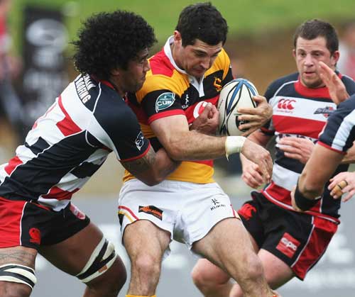 Waikato's All Black fly-half Stephen Donald is caught in traffic
